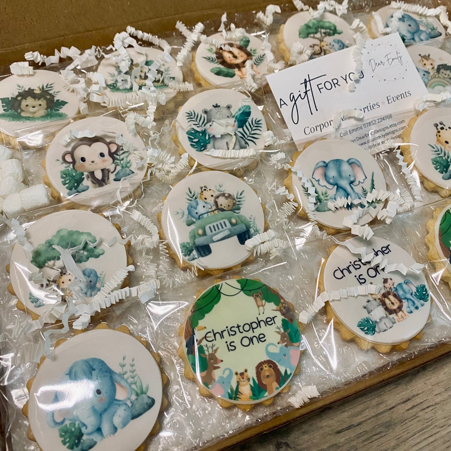 Wild One safari-themed biscuits featuring lion, elephant, and giraffe shapes for a child's birthday party"