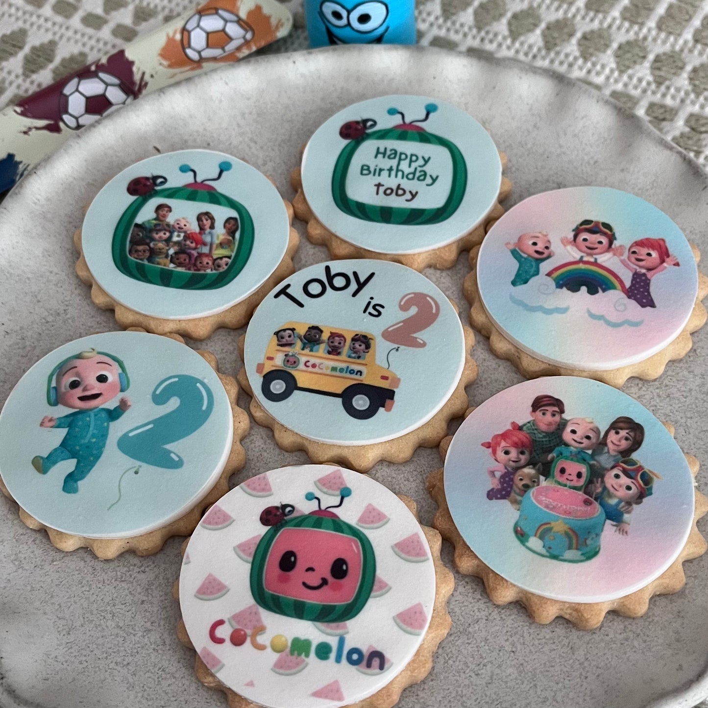 Colourful Cocomelon party themed biscuits featuring JJ and friends. Custom Cocomelon party themed biscuits for kids' celebrations