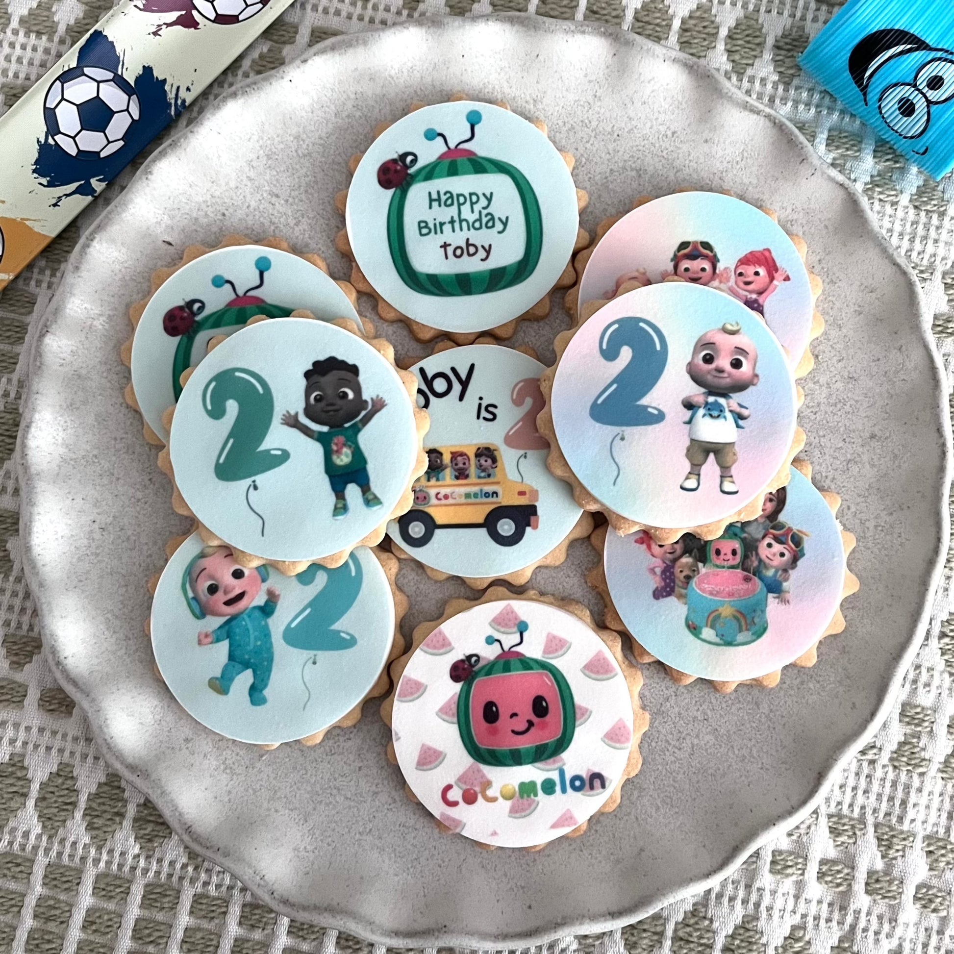 Colourful Cocomelon party themed biscuits featuring JJ and friends. Custom Cocomelon party themed biscuits for kids' celebrations