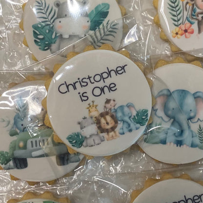 Wild One safari-themed biscuits featuring lion, elephant, and giraffe shapes for a child's birthday party"