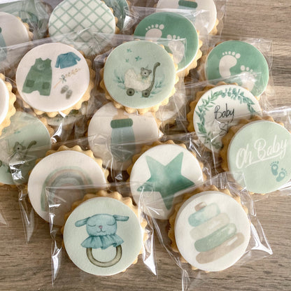 Beautifully decorated baby shower biscuits in pastel and neutral colours